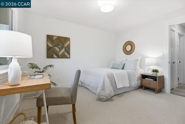 a bed room with a bed and a window