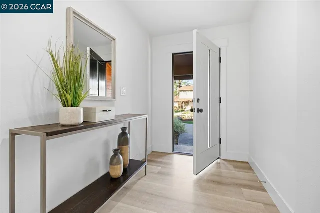 a view of living room with a flat screen tv and a window