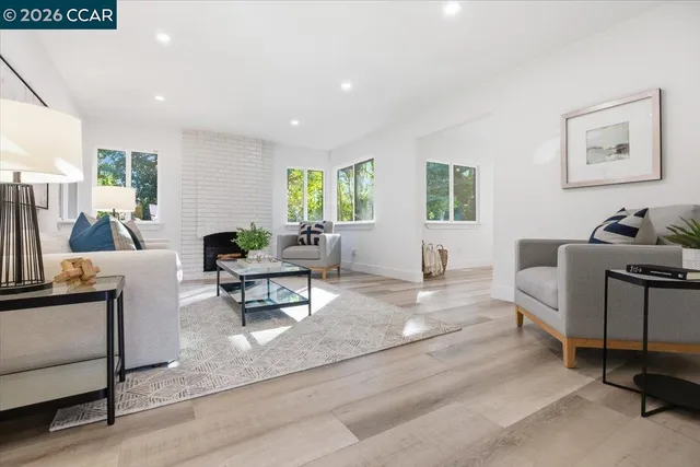 a living room with furniture and a large window