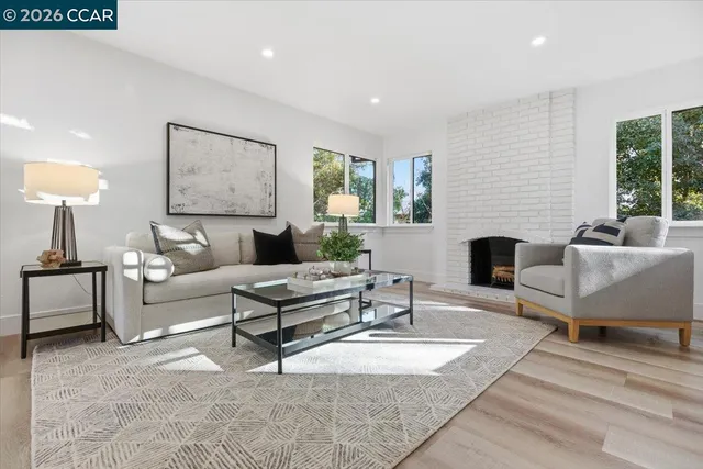 a living room with furniture a lamp and a fireplace