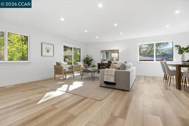 a living room with furniture and a table