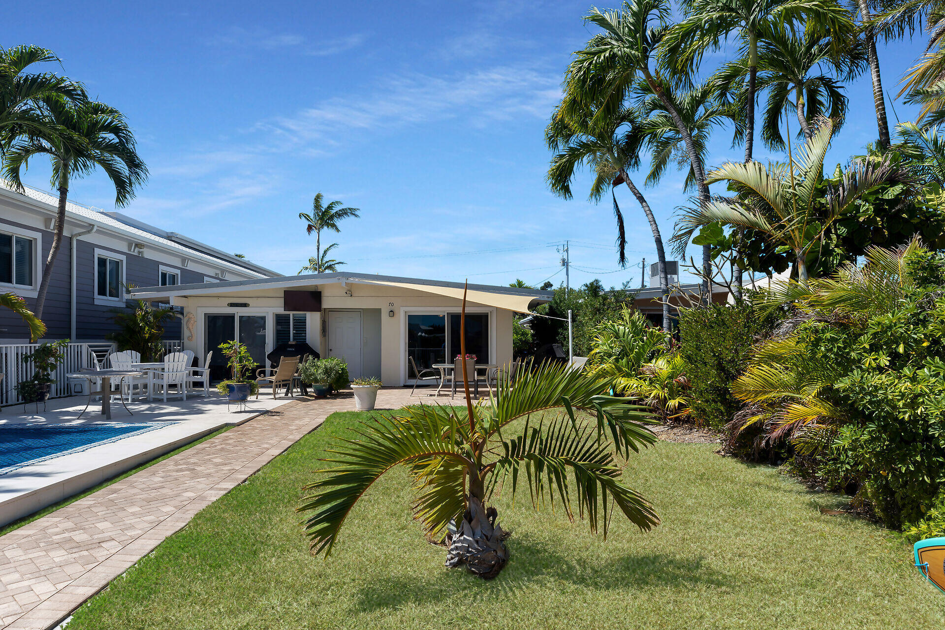 70 7th Street Key Colony Beach, FL 33051 - Photo 1 of 46 a view of a backyard with plants and a patio