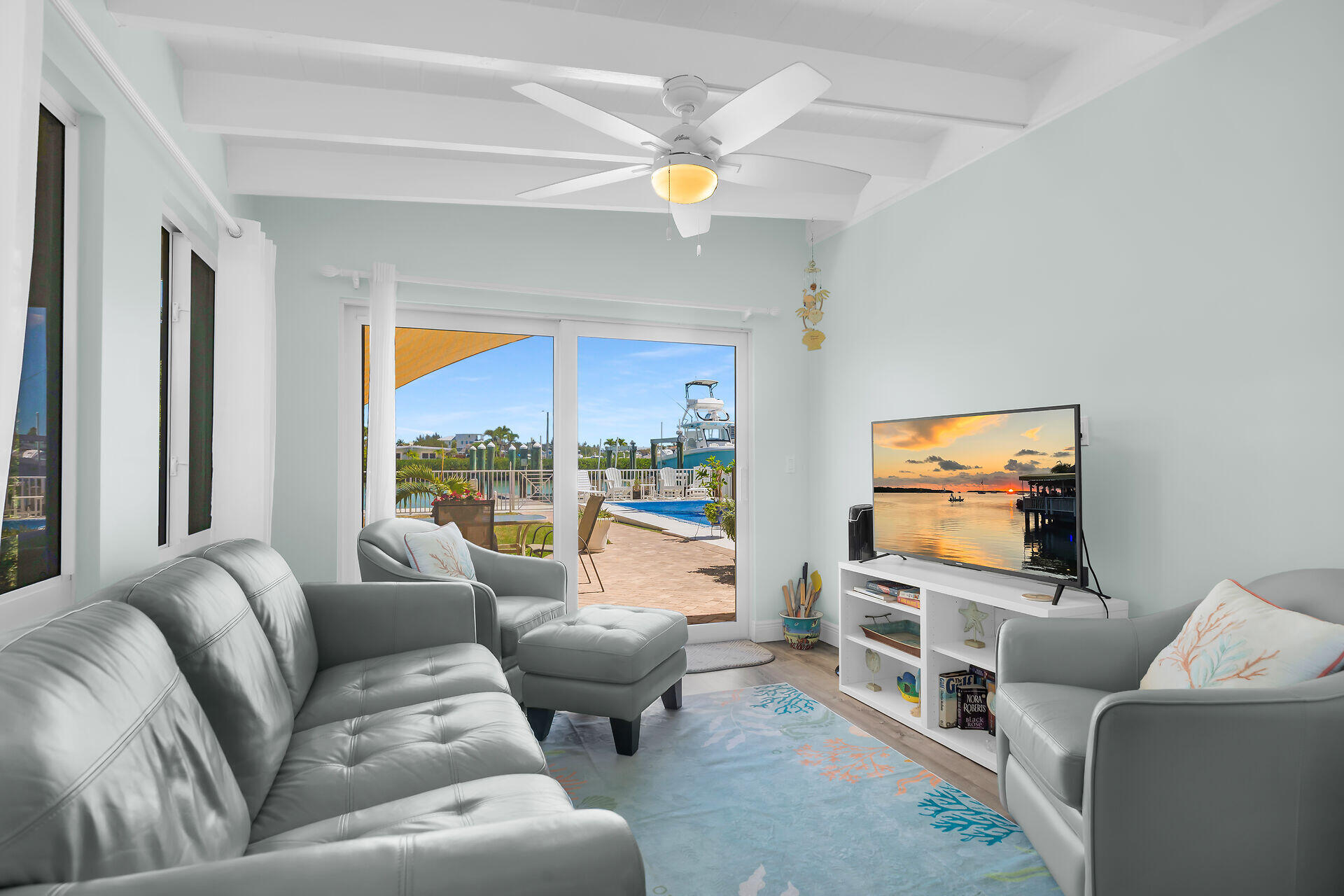 70 7th Street Key Colony Beach, FL 33051 - Photo 14 of 46 a living room with furniture and a flat screen tv
