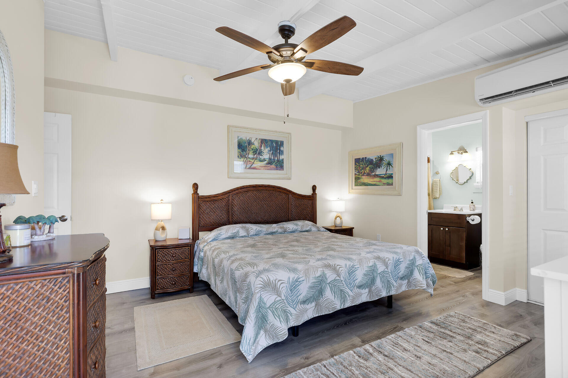 70 7th Street Key Colony Beach, FL 33051 - Photo 17 of 46 a bedroom with a large bed and a chandelier