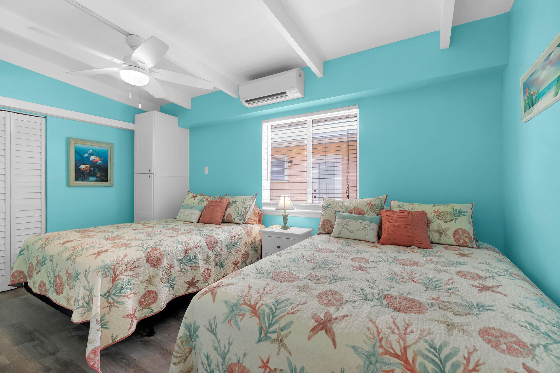 70 7th Street Key Colony Beach, FL 33051 - Photo 20 of 46 a bedroom with two beds and a large window