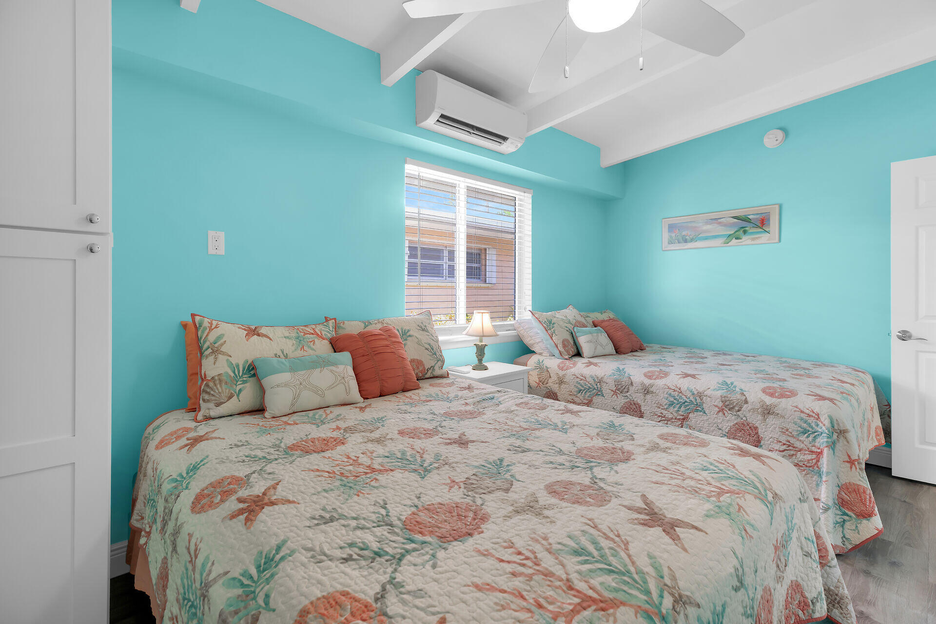 70 7th Street Key Colony Beach, FL 33051 - Photo 21 of 46 a bedroom with a large bed and a window