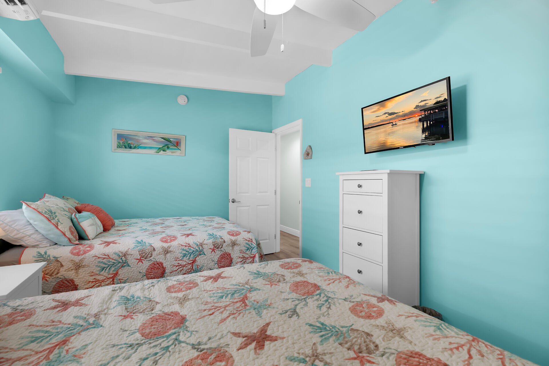 70 7th Street Key Colony Beach, FL 33051 - Photo 22 of 46 a bedroom with a bed and a flat screen tv