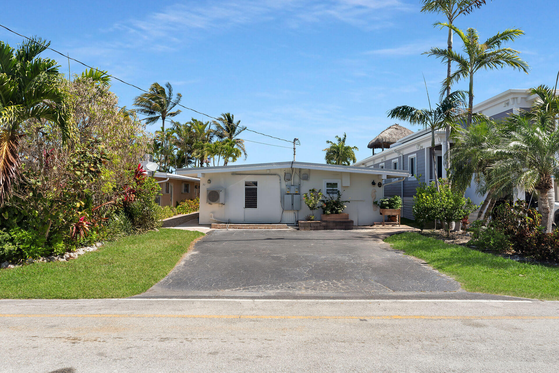 70 7th Street Key Colony Beach, FL 33051 - Photo 27 of 46 front view of a house with a small yard