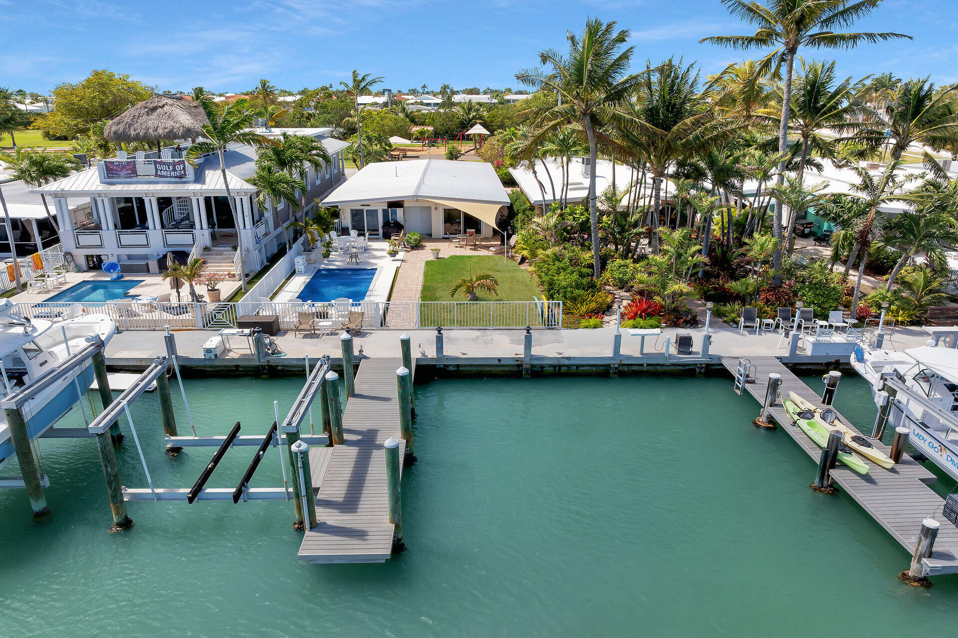 70 7th Street Key Colony Beach, FL 33051 - Photo 3 of 46 an aerial view of a house with outdoor space pool seating area and furniture