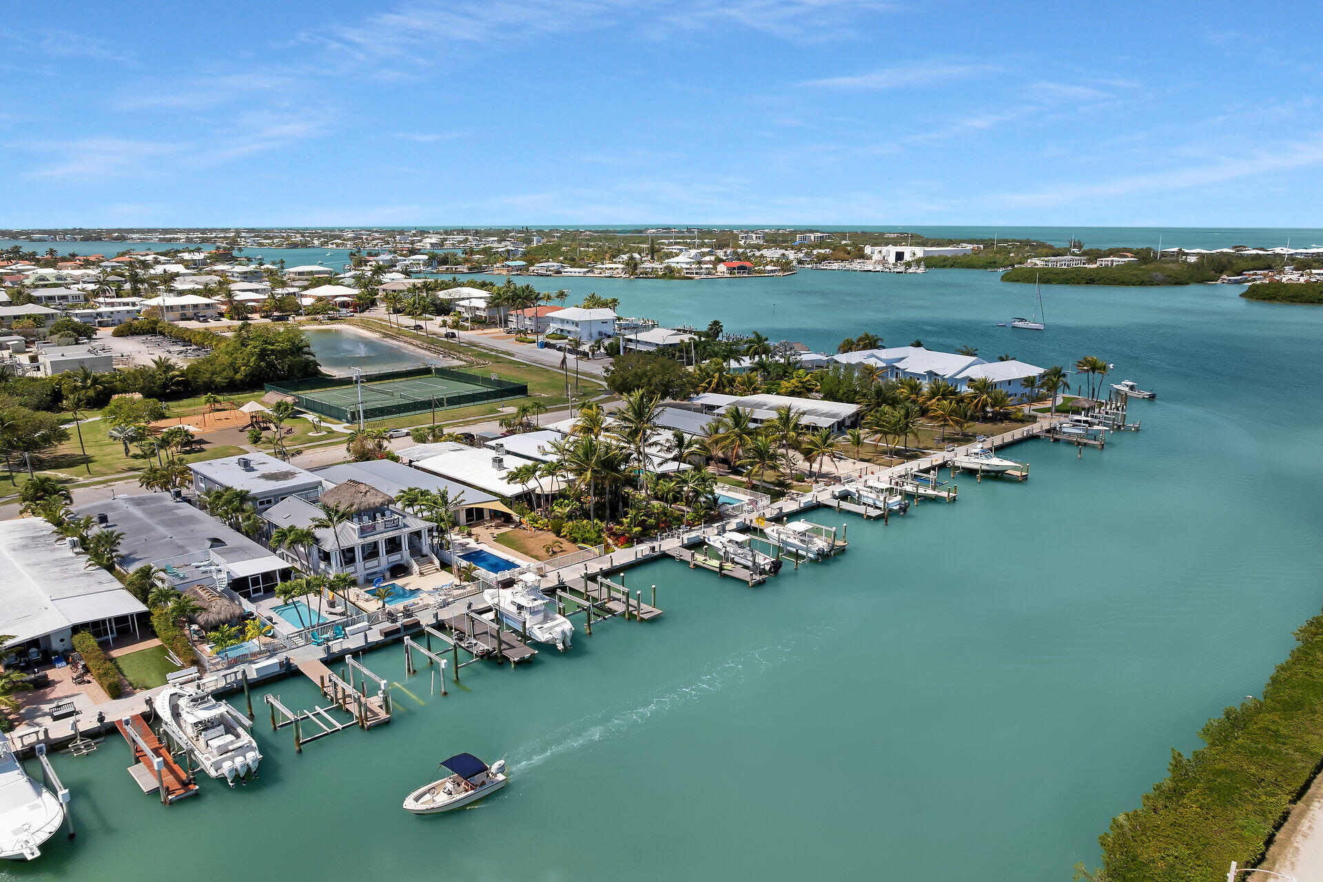 70 7th Street Key Colony Beach, FL 33051 - Photo 38 of 46 an aerial view of a city with lots of residential buildings ocean and mountain view in back