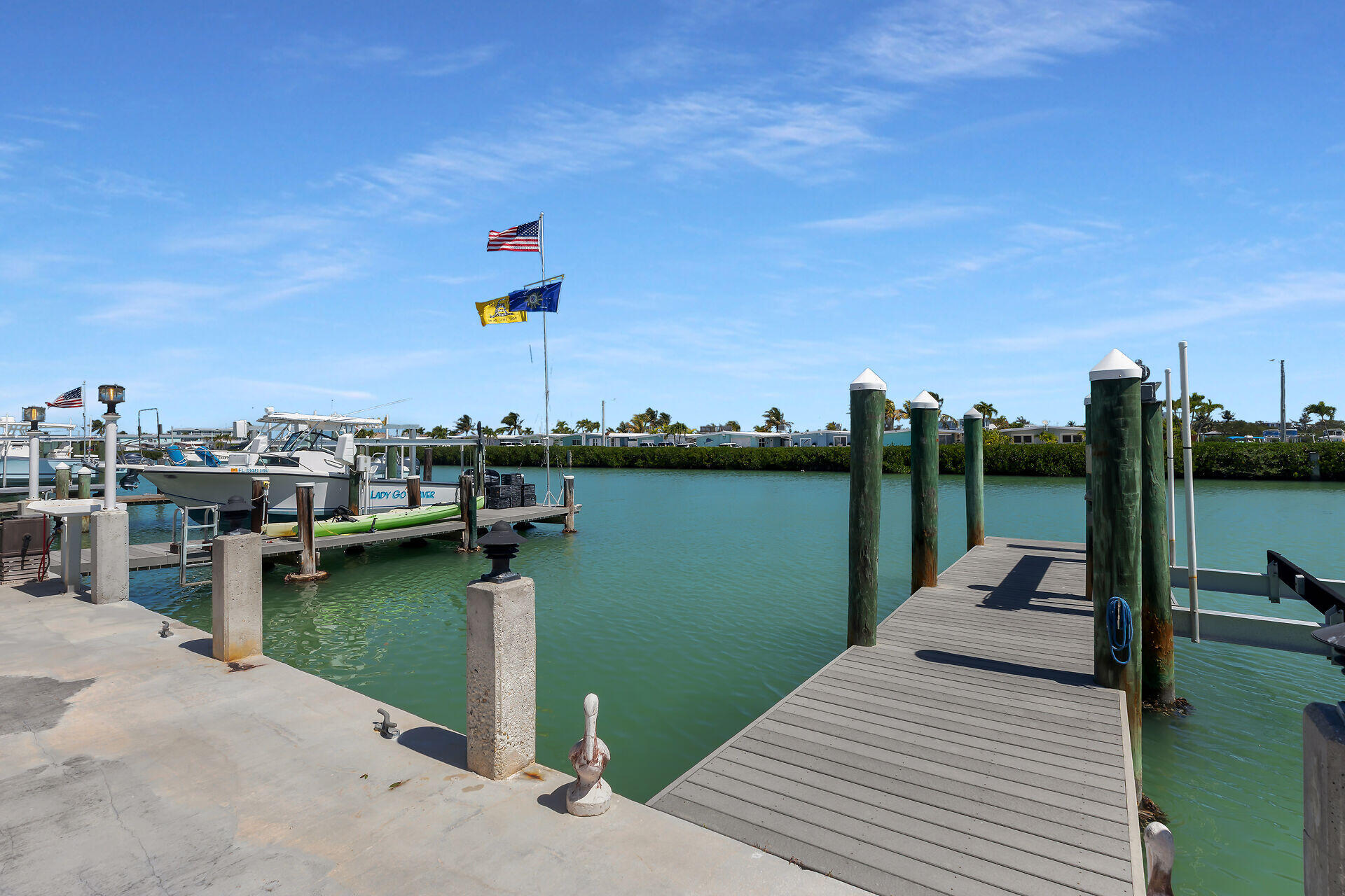 70 7th Street Key Colony Beach, FL 33051 - Photo 4 of 46 a view of a lake with boats and trees in the background