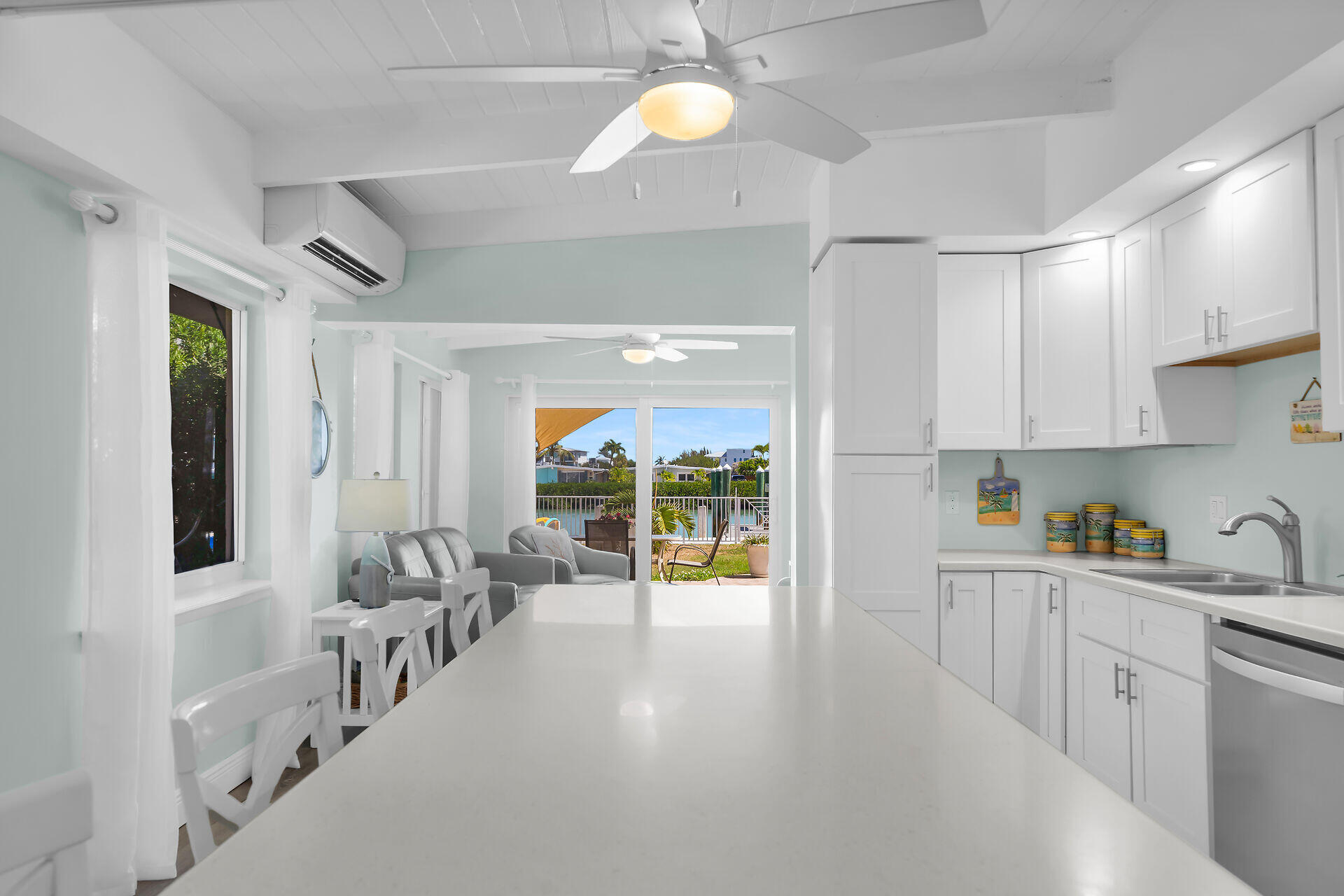 70 7th Street Key Colony Beach, FL 33051 - Photo 8 of 46 a very nice looking room with a large window and chandelier