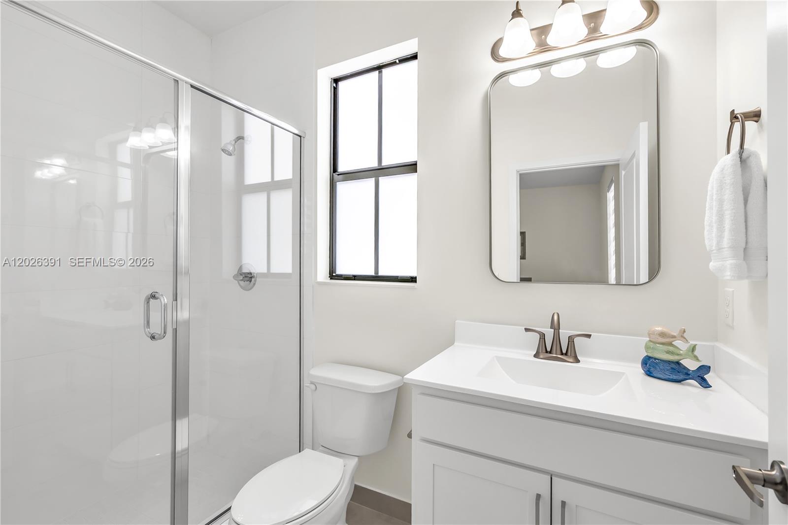 14606 Southwest 22nd Terrace Miami, FL 33175 - Photo 40 of 43 a bathroom with a sink toilet a mirror and shower