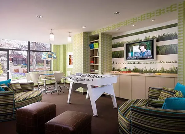 a living room with stainless steel appliances kitchen island granite countertop furniture and a large window