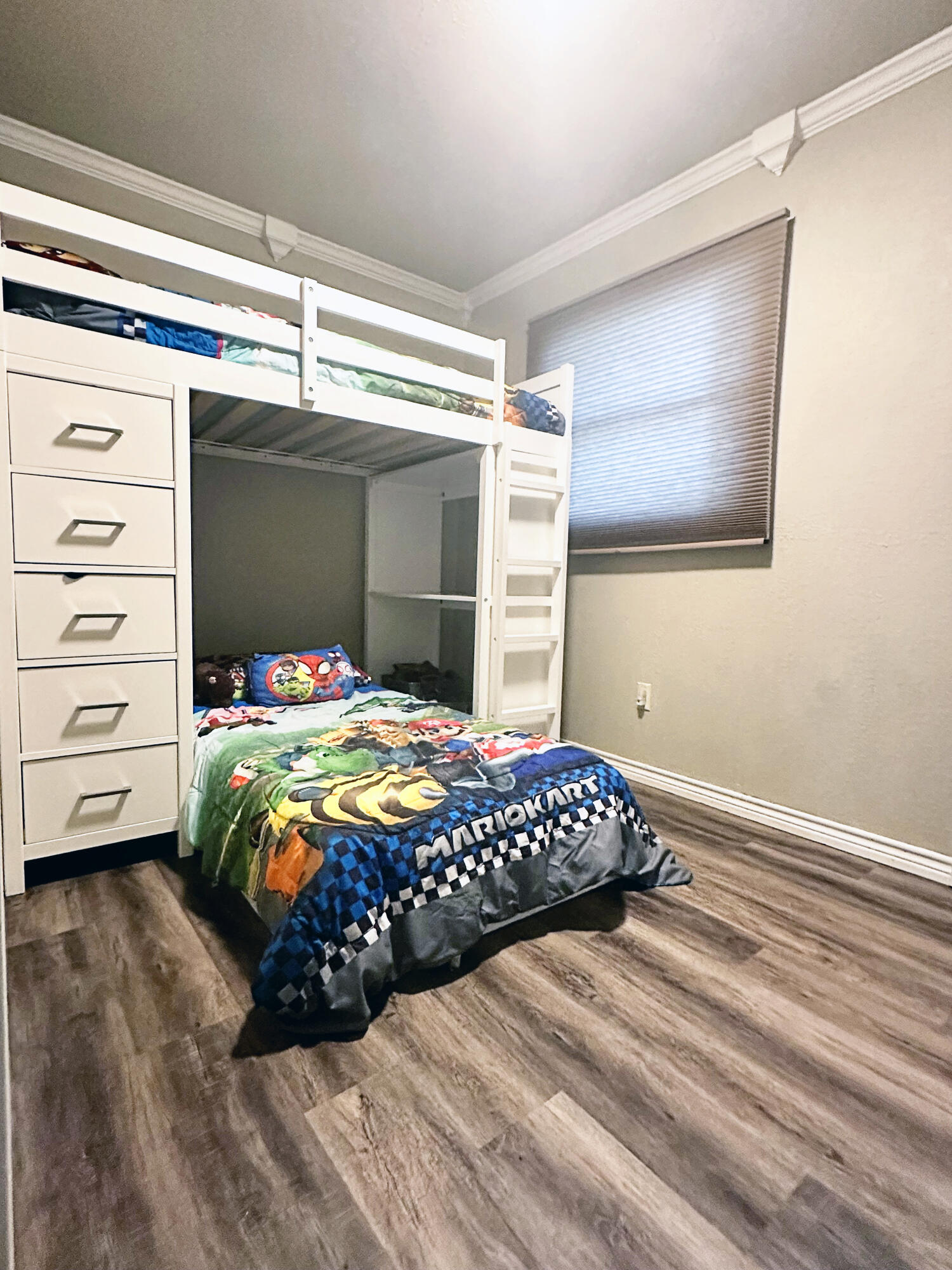 5712 70th Place Lubbock, TX 79424 - Photo 16 of 45 a bedroom with a bed and a window