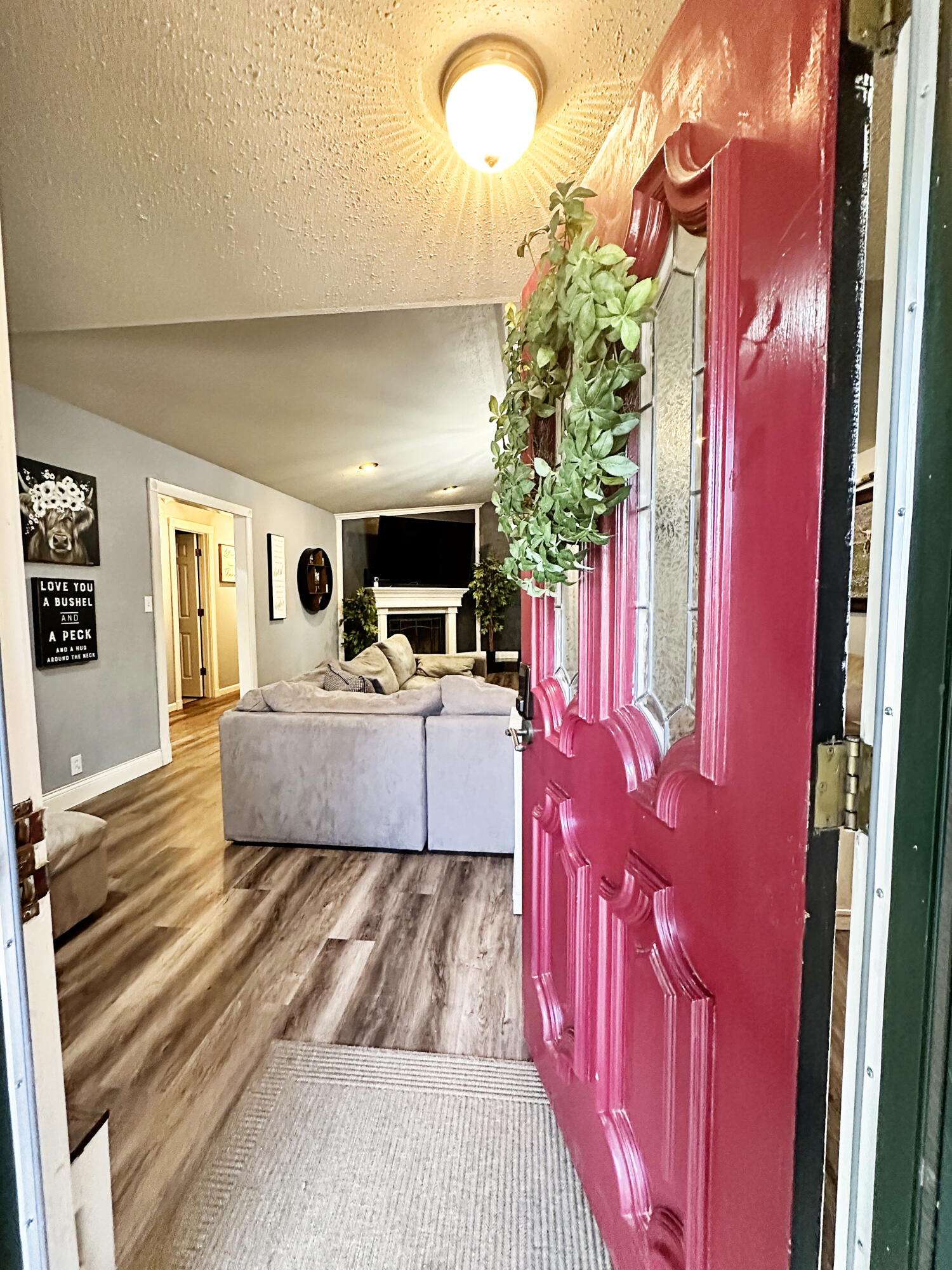5712 70th Place Lubbock, TX 79424 - Photo 17 of 45 a living room with furniture and a flat screen tv