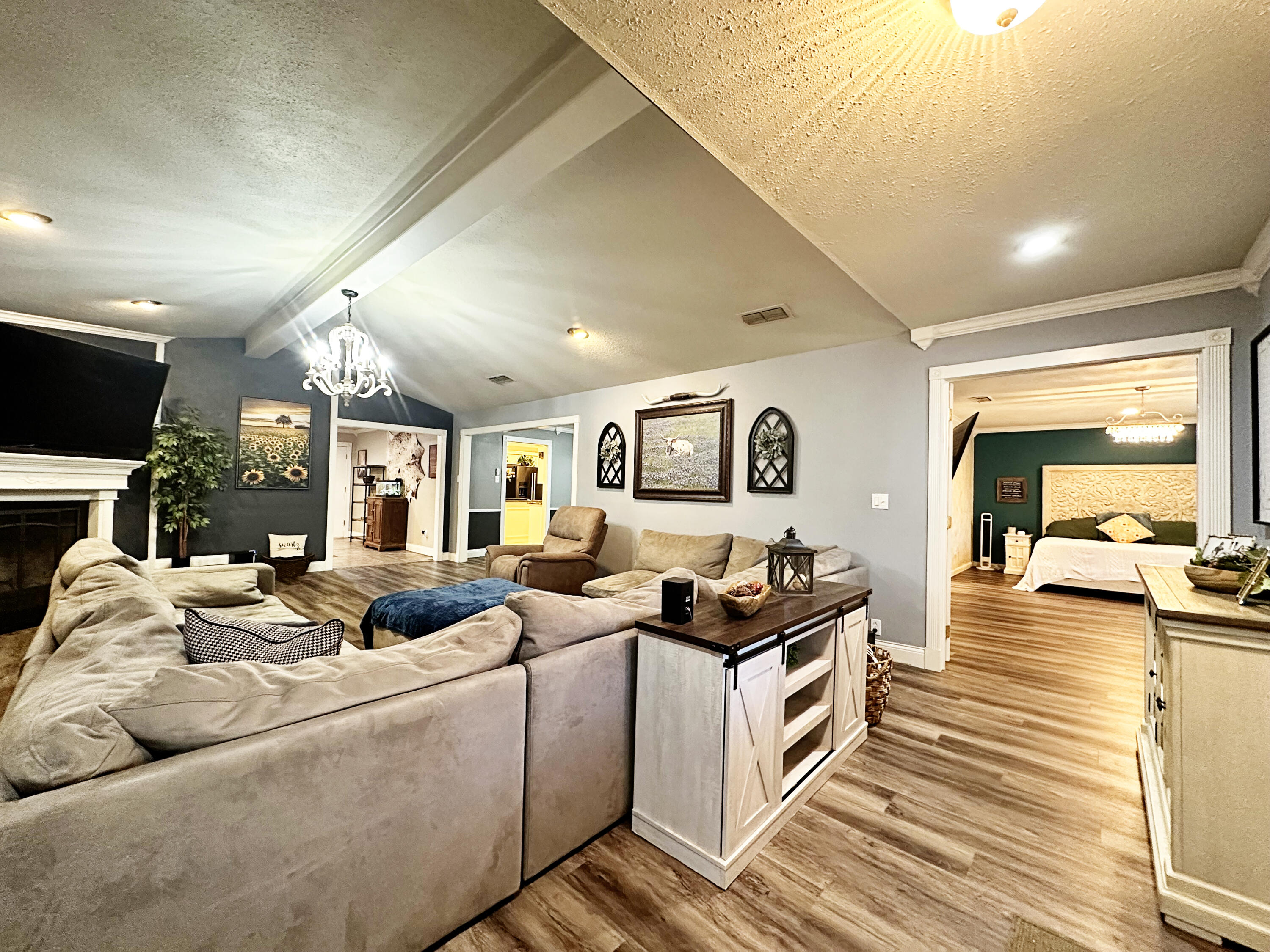 5712 70th Place Lubbock, TX 79424 - Photo 22 of 45 a living room with furniture and a flat screen tv