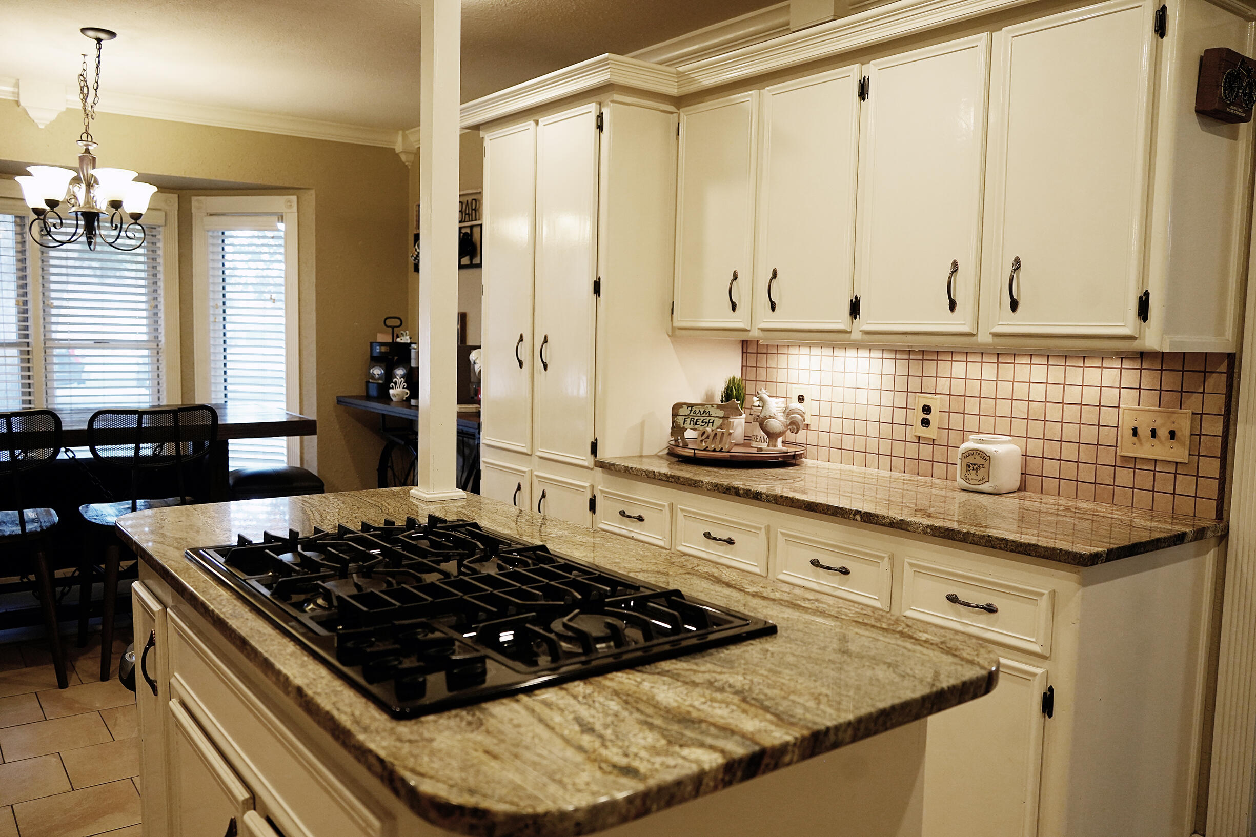 5712 70th Place Lubbock, TX 79424 - Photo 6 of 45 a kitchen with stainless steel appliances granite countertop a stove a sink and a granite counter tops