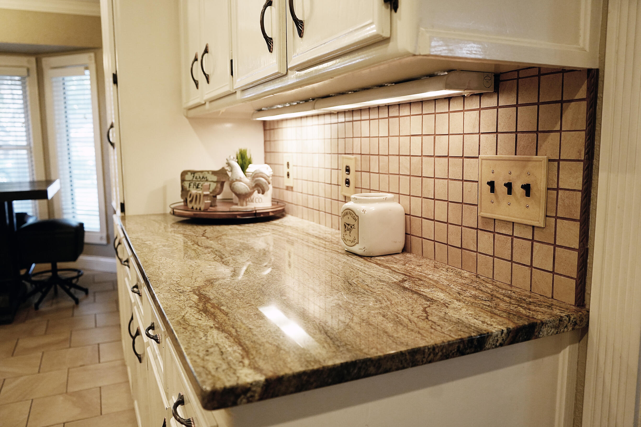 5712 70th Place Lubbock, TX 79424 - Photo 7 of 45 a bathroom with a sink and a mirror