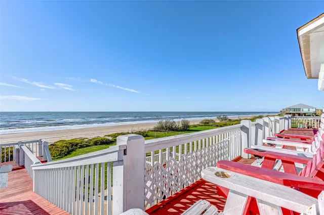 a view of a balcony with wooden floor