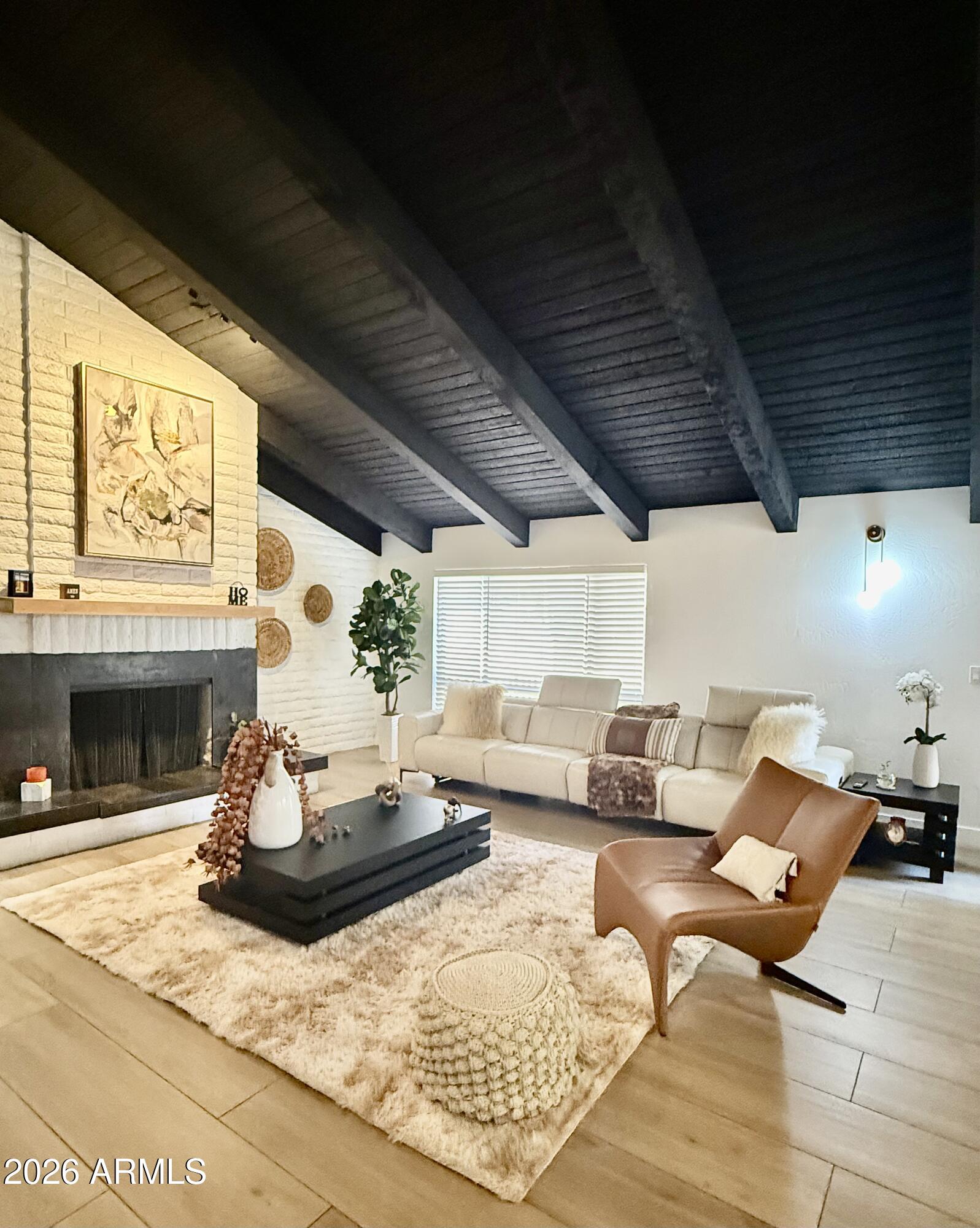 22 West Royal Palm Road Phoenix, AZ 85021 - Photo 11 of 26 a living room with furniture and a fireplace