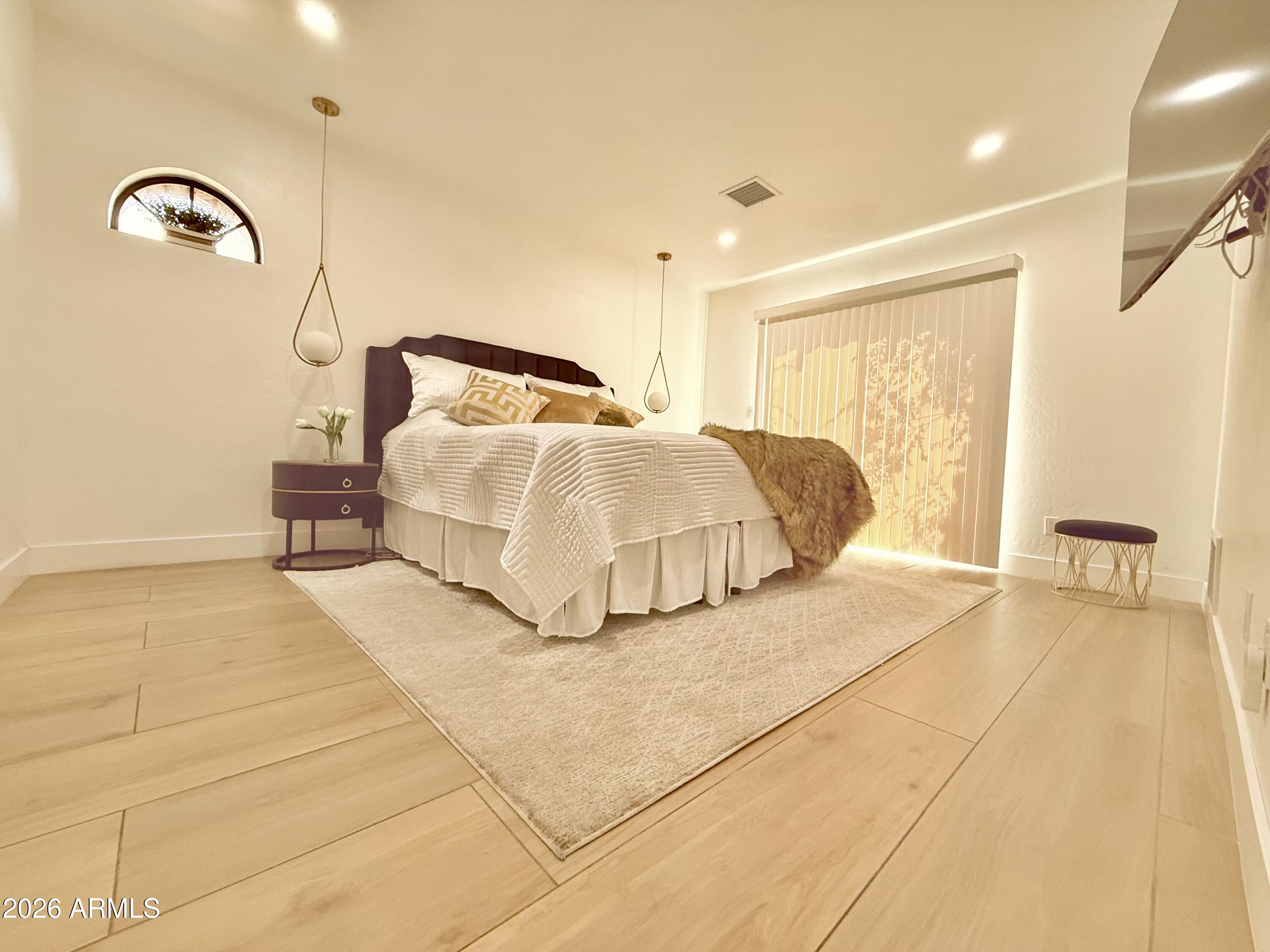 22 West Royal Palm Road Phoenix, AZ 85021 - Photo 14 of 26 a bedroom with a bed and a large window