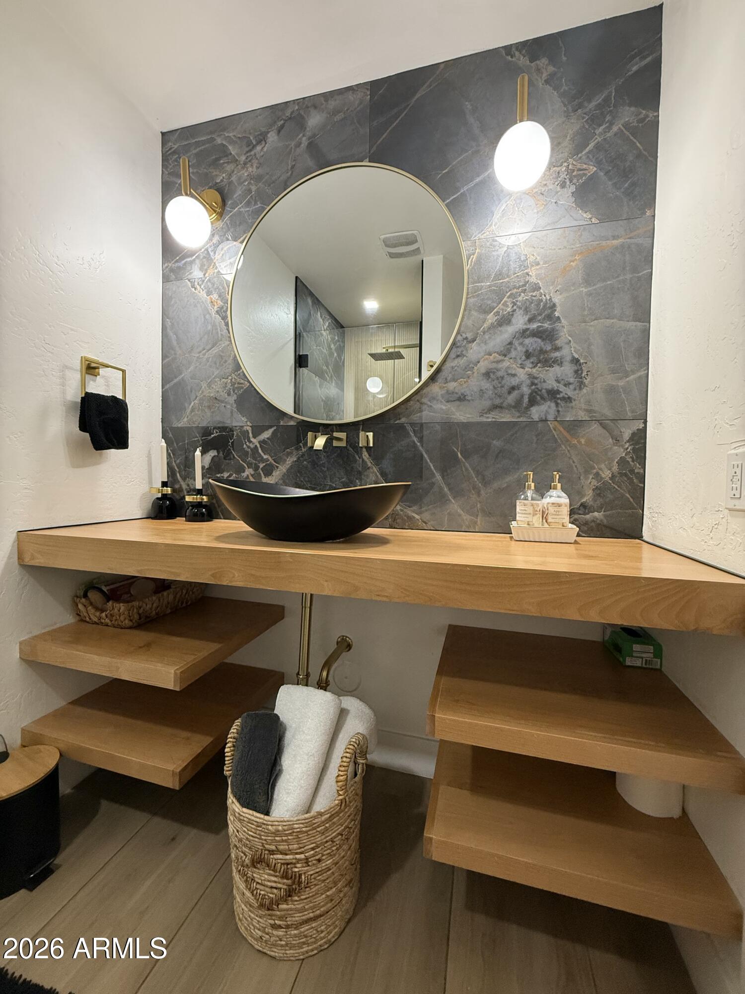 22 West Royal Palm Road Phoenix, AZ 85021 - Photo 15 of 26 a bathroom with a mirror and vanity