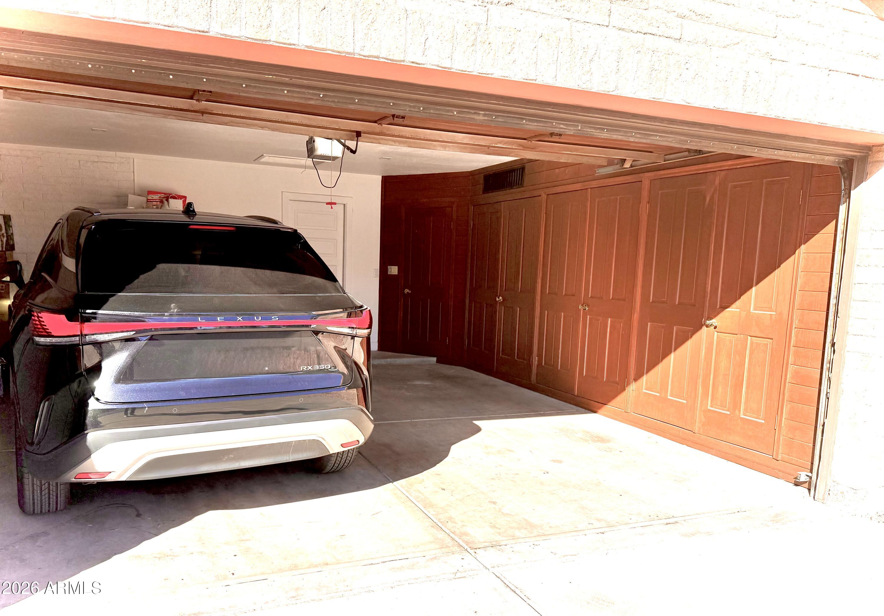 22 West Royal Palm Road Phoenix, AZ 85021 - Photo 25 of 26 a bedroom with a bed and a mirror