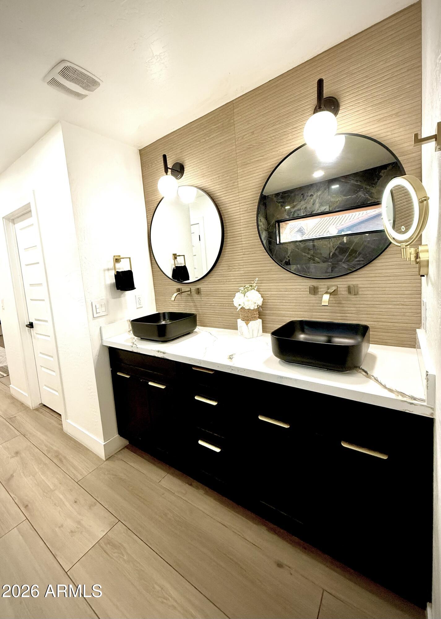 22 West Royal Palm Road Phoenix, AZ 85021 - Photo 26 of 26 a bathroom with a double vanity sink and a mirror