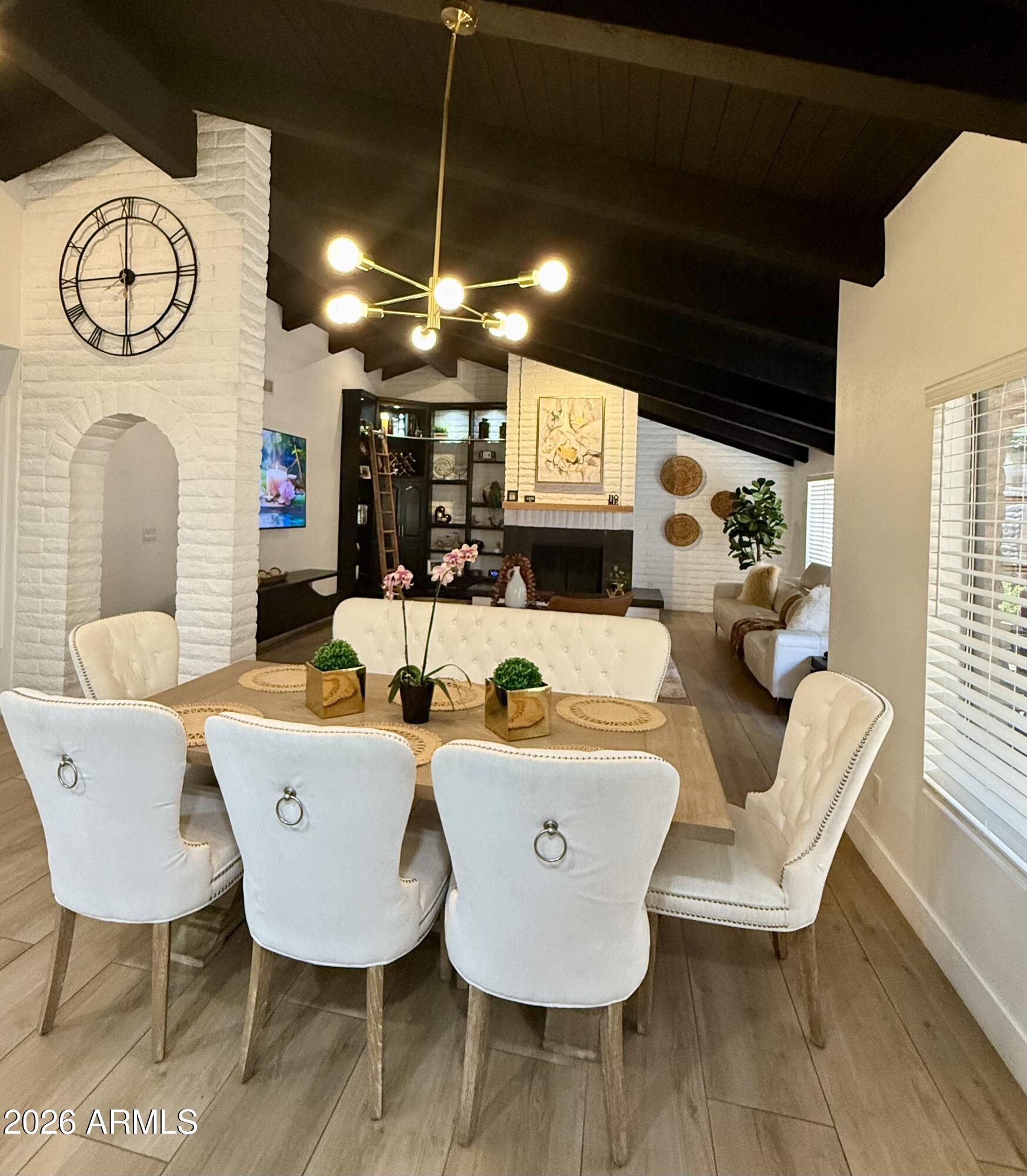 22 West Royal Palm Road Phoenix, AZ 85021 - Photo 4 of 26 a view of a dining room with furniture and a chandelier