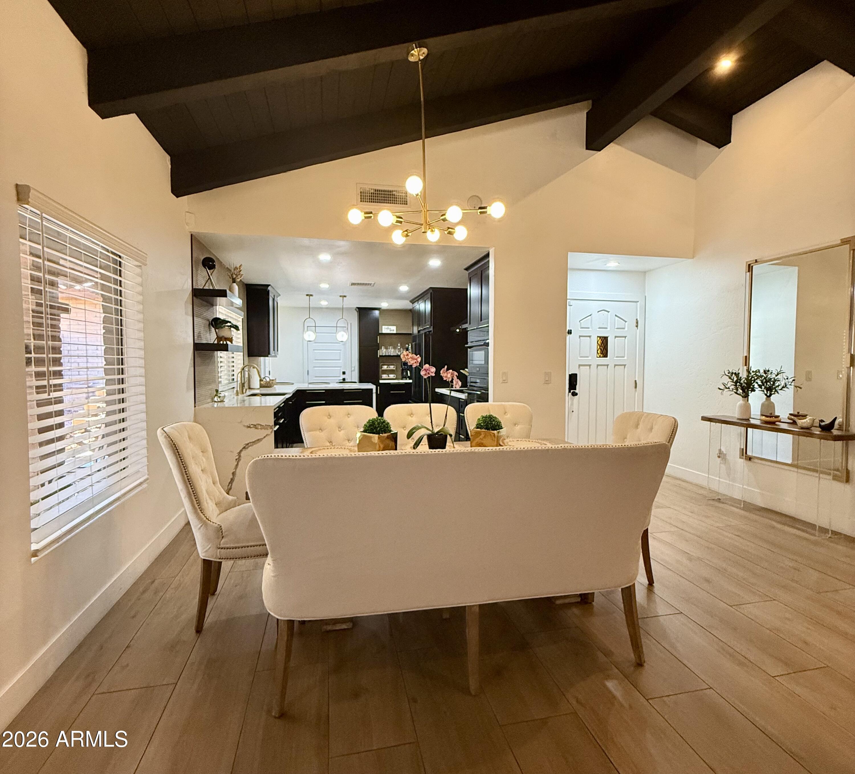22 West Royal Palm Road Phoenix, AZ 85021 - Photo 5 of 26 a view of a dining room with furniture window and wooden floor