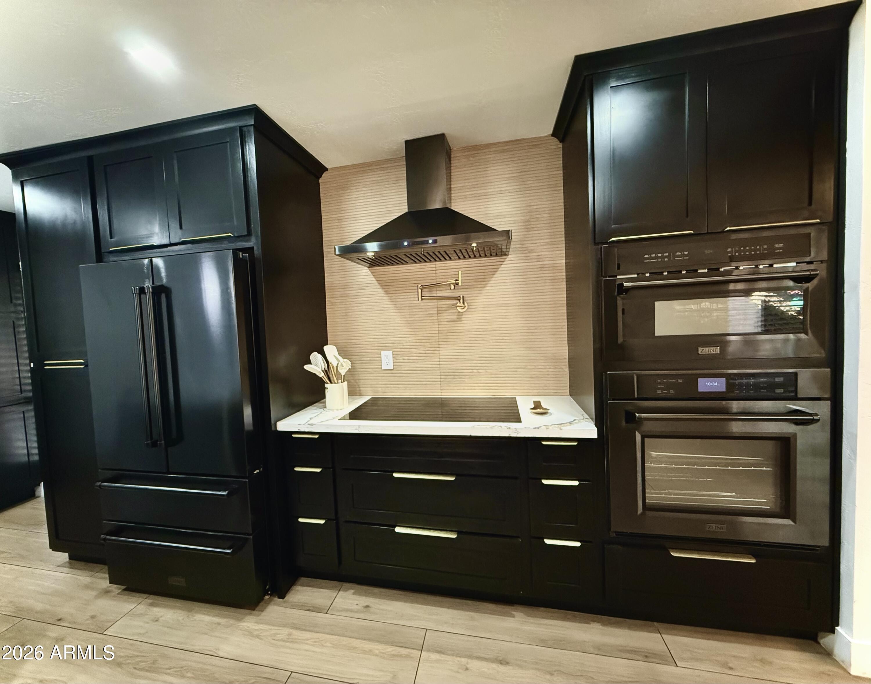 22 West Royal Palm Road Phoenix, AZ 85021 - Photo 8 of 26 a kitchen with a refrigerator and a stove