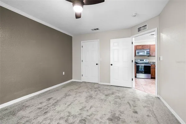 a view of a livingroom with a kitchen