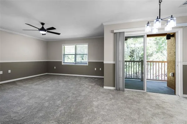 a view of an empty room with a window