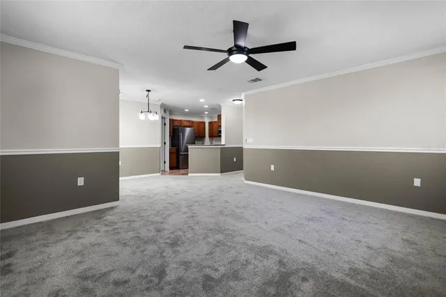 a view of a kitchen and a ceiling fan