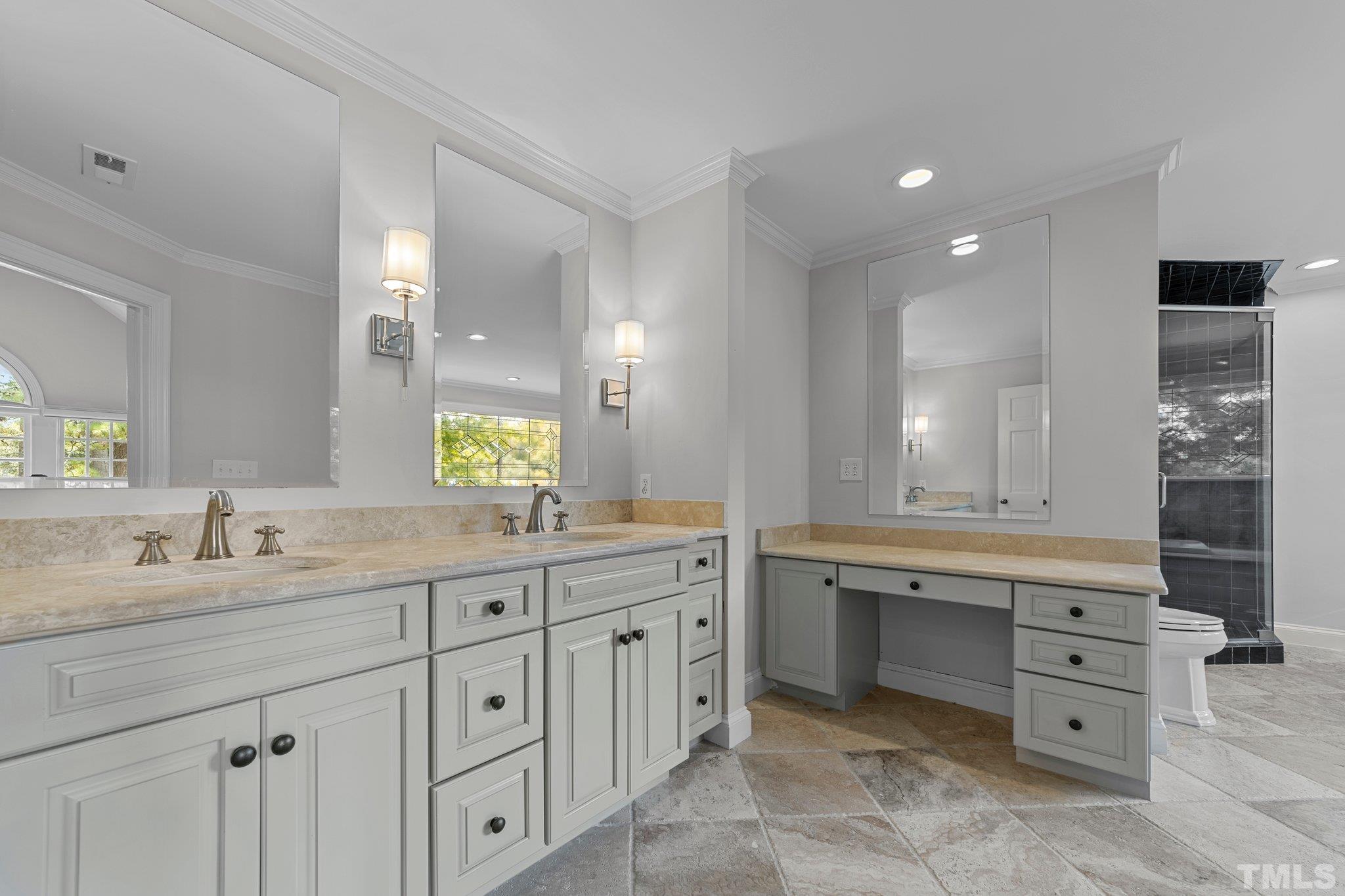 3101 Cornwall Road Durham, NC 27707 - Photo 21 of 30 a bathroom with a granite countertop double sink mirror and a