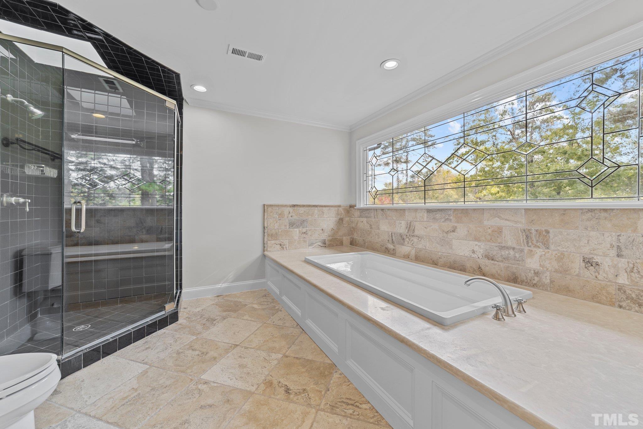 3101 Cornwall Road Durham, NC 27707 - Photo 22 of 30 a bathroom with a bathtub and a shower