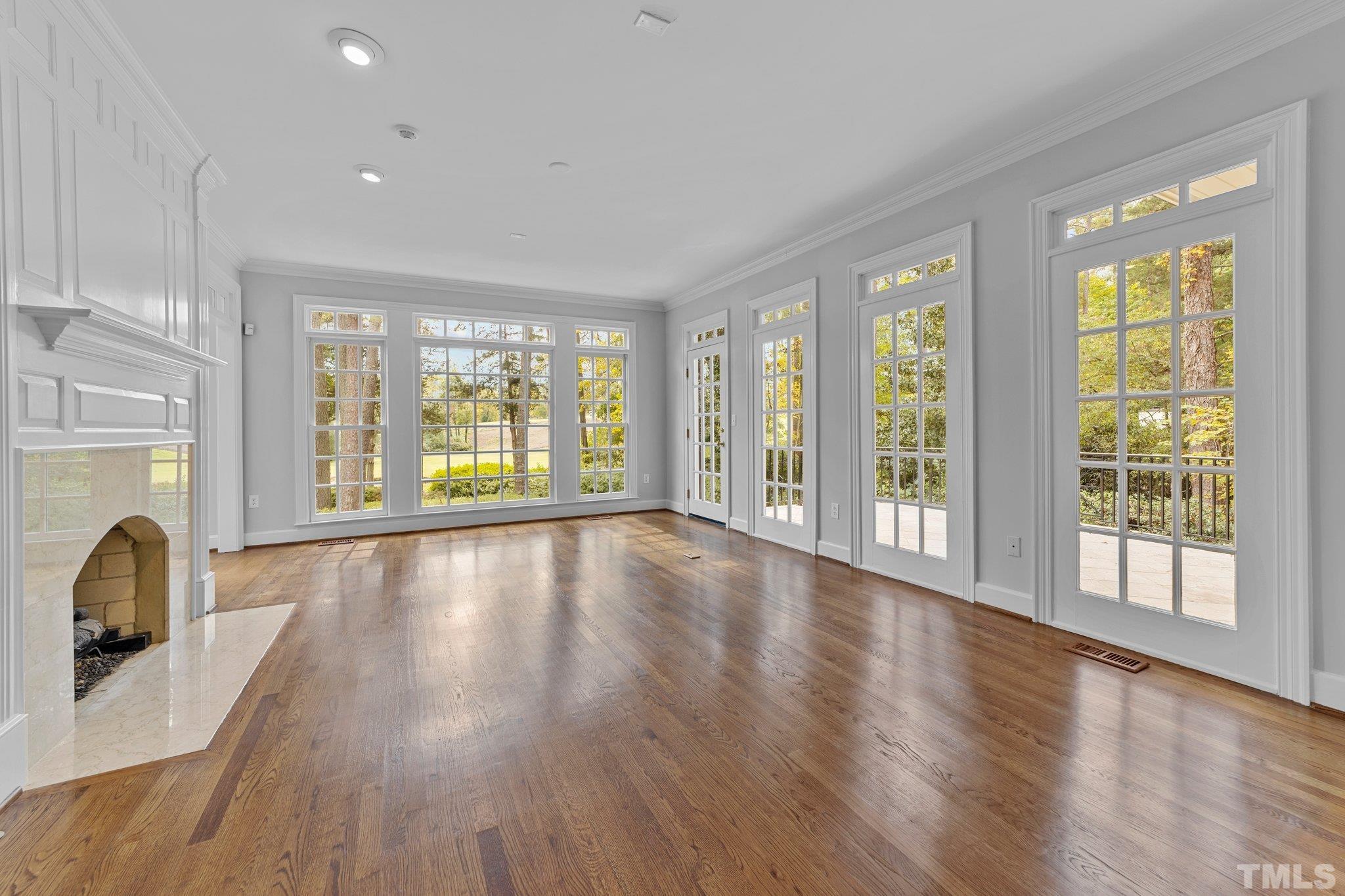 3101 Cornwall Road Durham, NC 27707 - Photo 8 of 30 a view of an empty room with wooden floor and a window