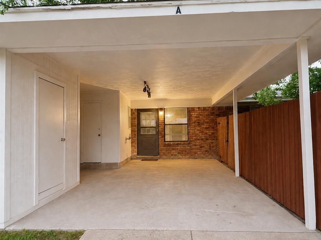 2111 Quail Run, Unit A McKinney, TX 75071 - Photo 11 of 12 a view of a hallway with wooden fence