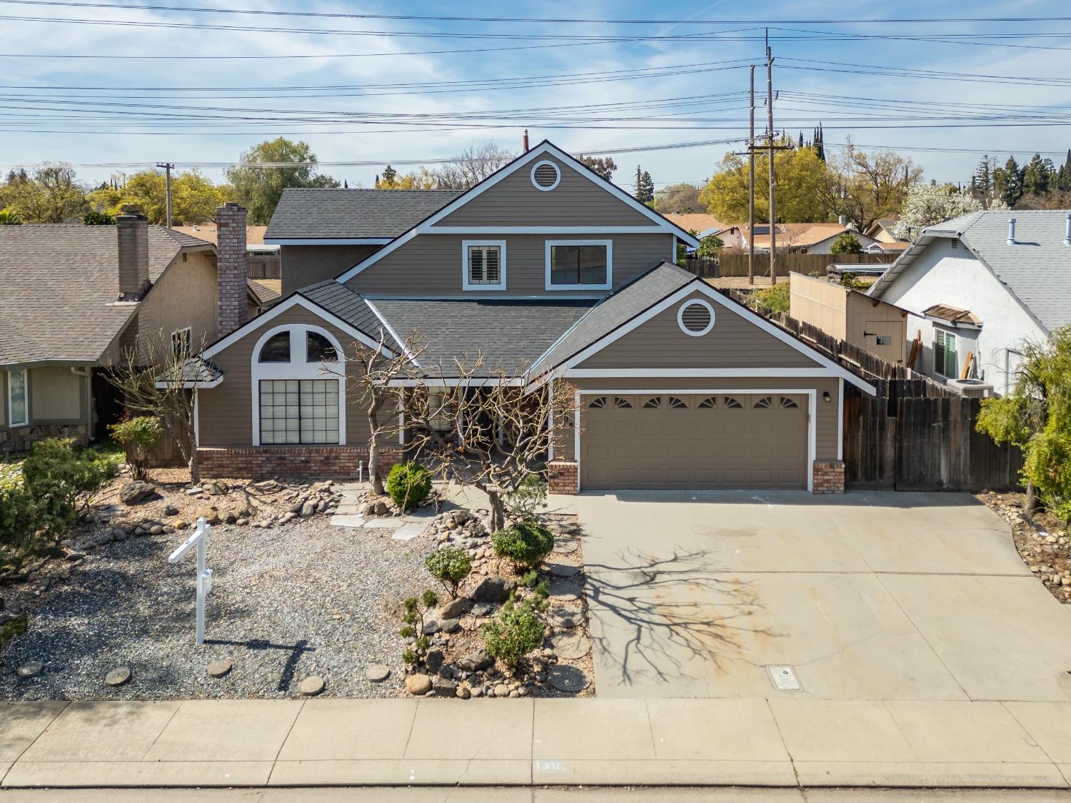 a front view of a house with a outdoor space