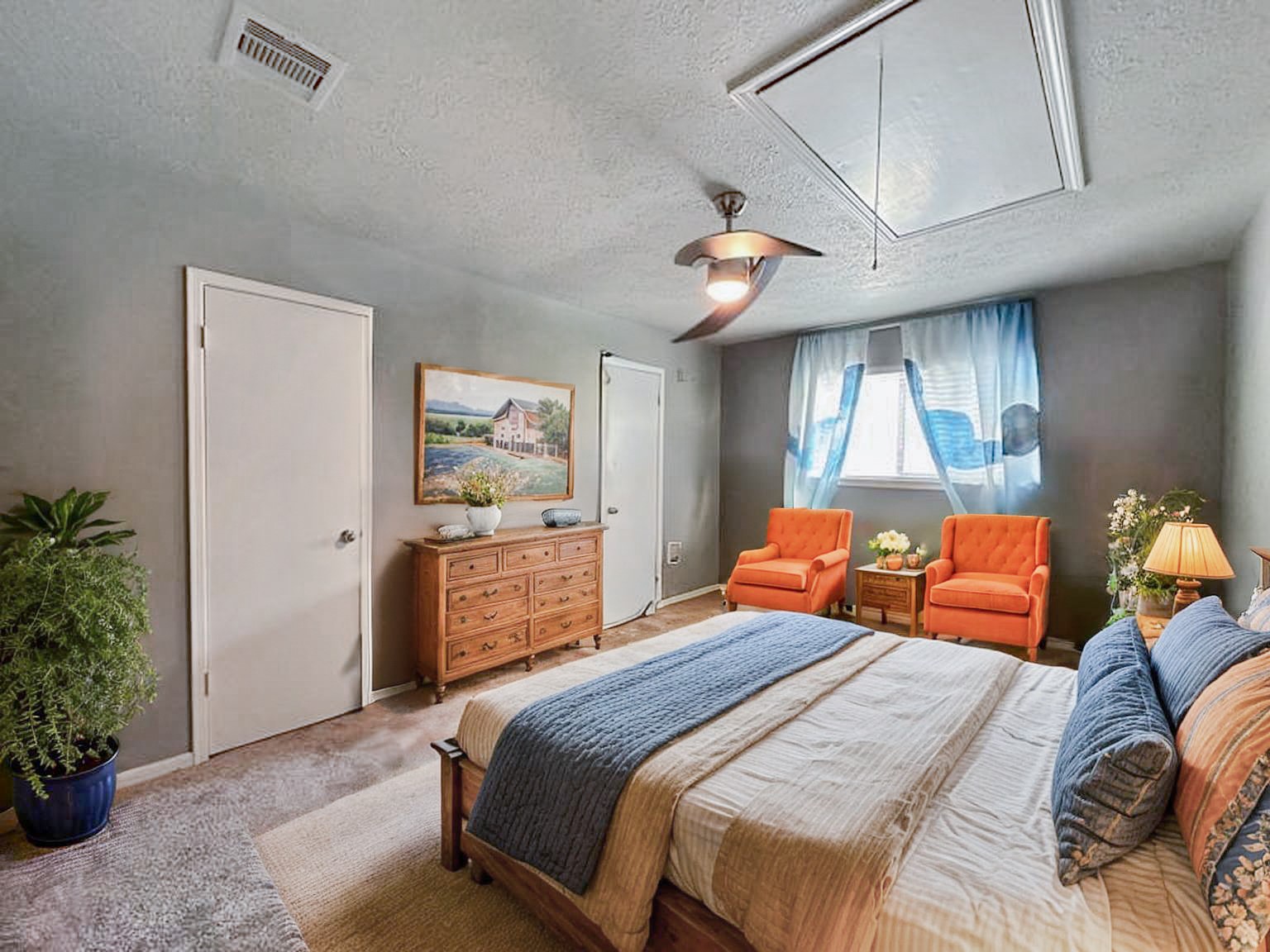 17407 Majestic Forest Drive Spring, TX 77379 - Photo 11 of 49 a bedroom with a bed and a potted plant