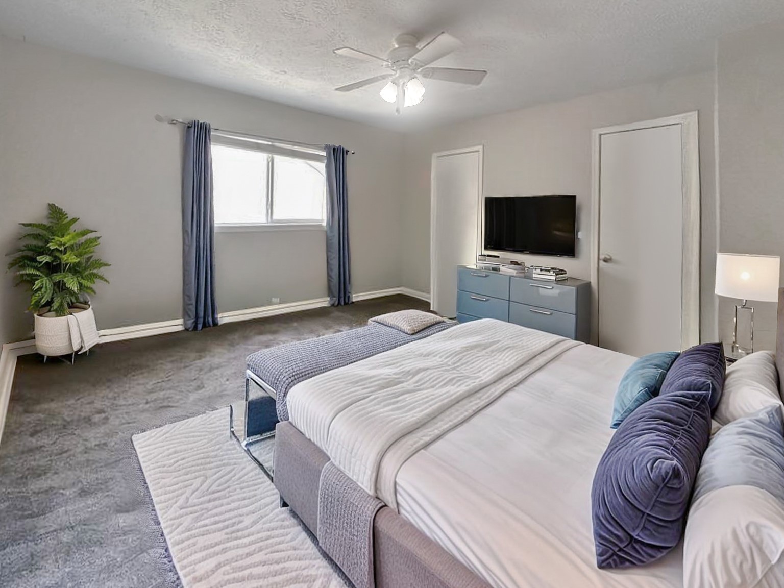 17407 Majestic Forest Drive Spring, TX 77379 - Photo 12 of 49 a bedroom with a bed and a flat screen tv