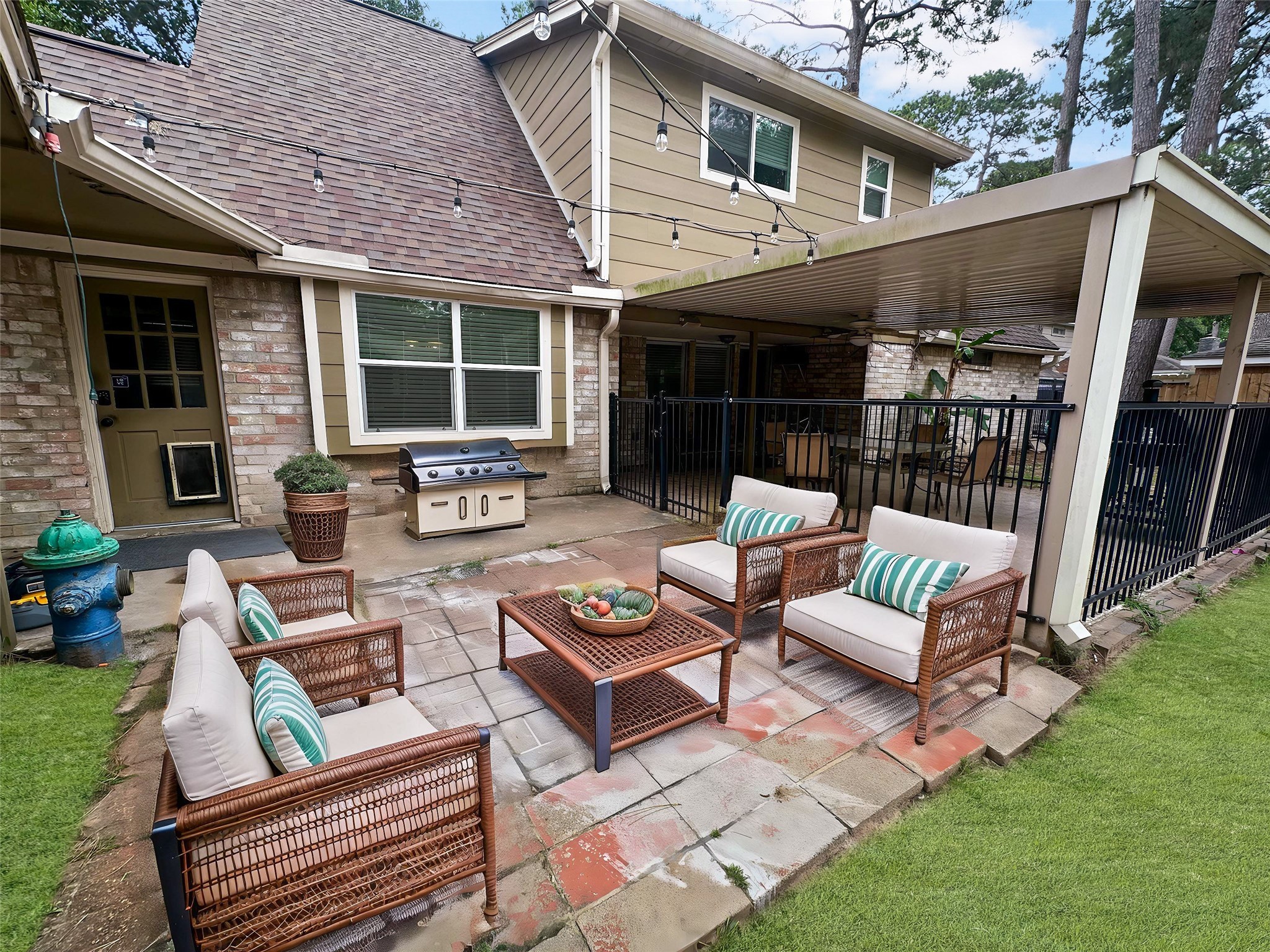 17407 Majestic Forest Drive Spring, TX 77379 - Photo 17 of 49 a view of a patio with couches and a table and chairs with garden view