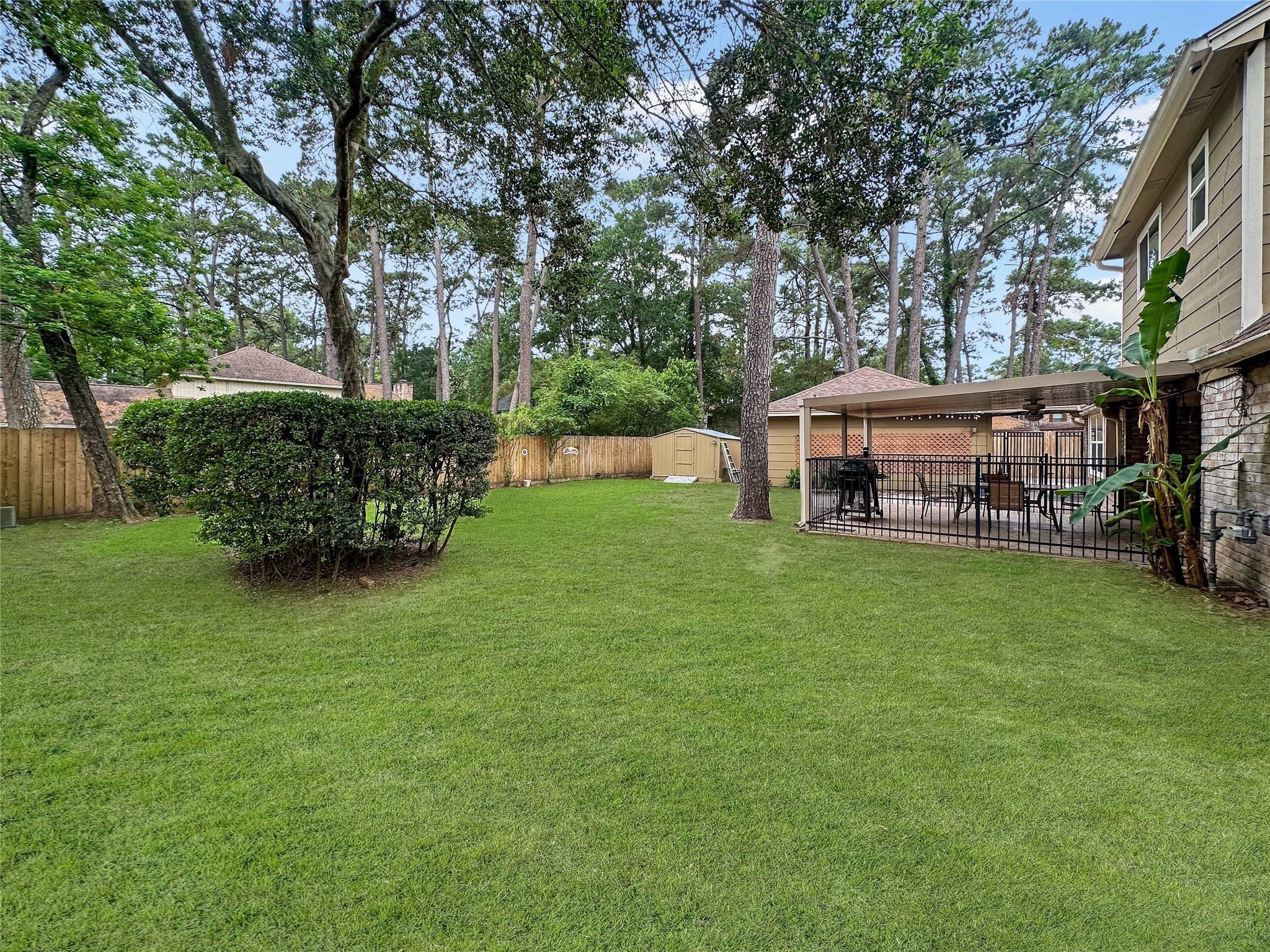 17407 Majestic Forest Drive Spring, TX 77379 - Photo 18 of 49 a view of a house with a backyard porch and sitting area