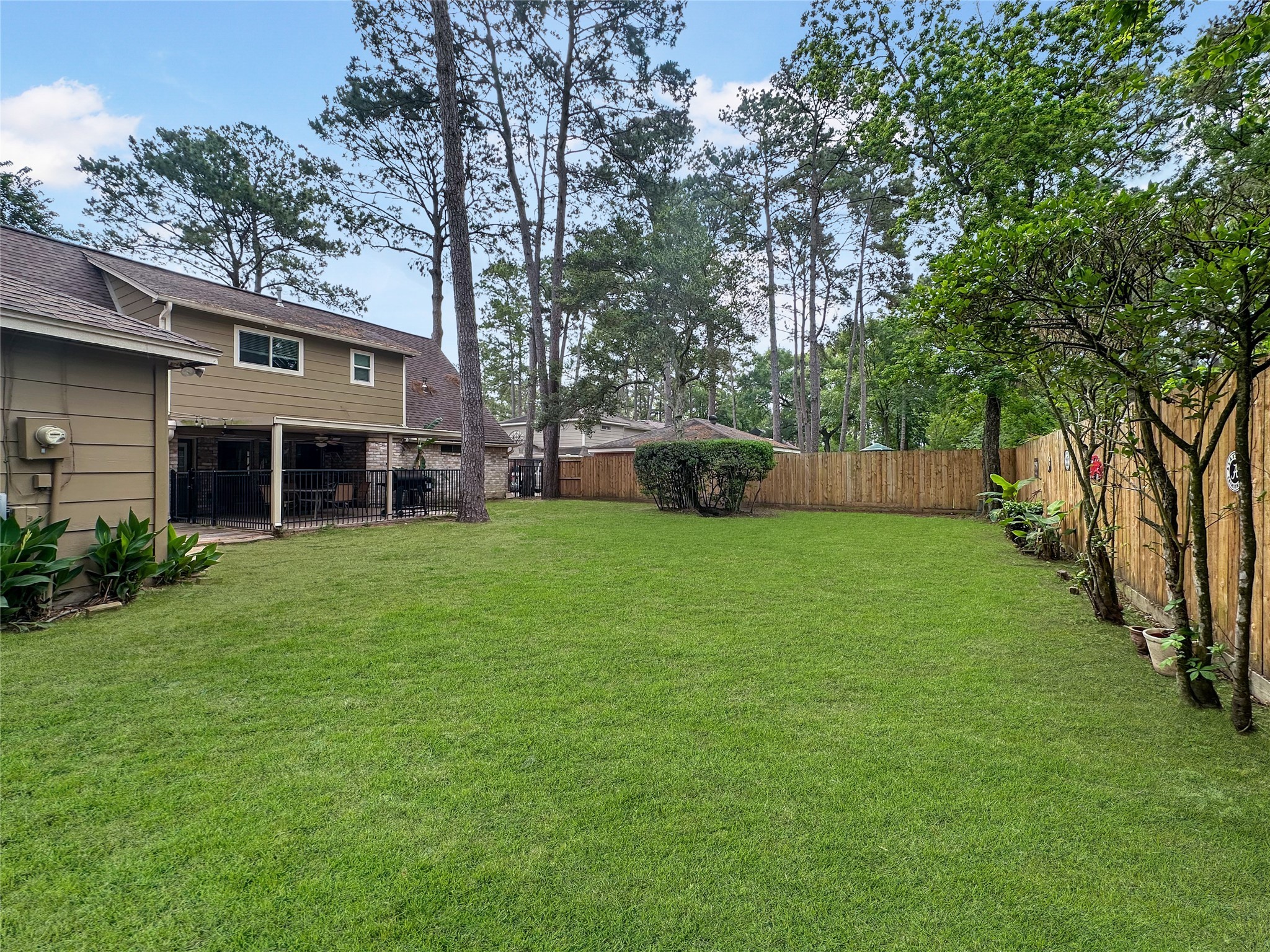 17407 Majestic Forest Drive Spring, TX 77379 - Photo 19 of 49 a view of a house with a yard and tree