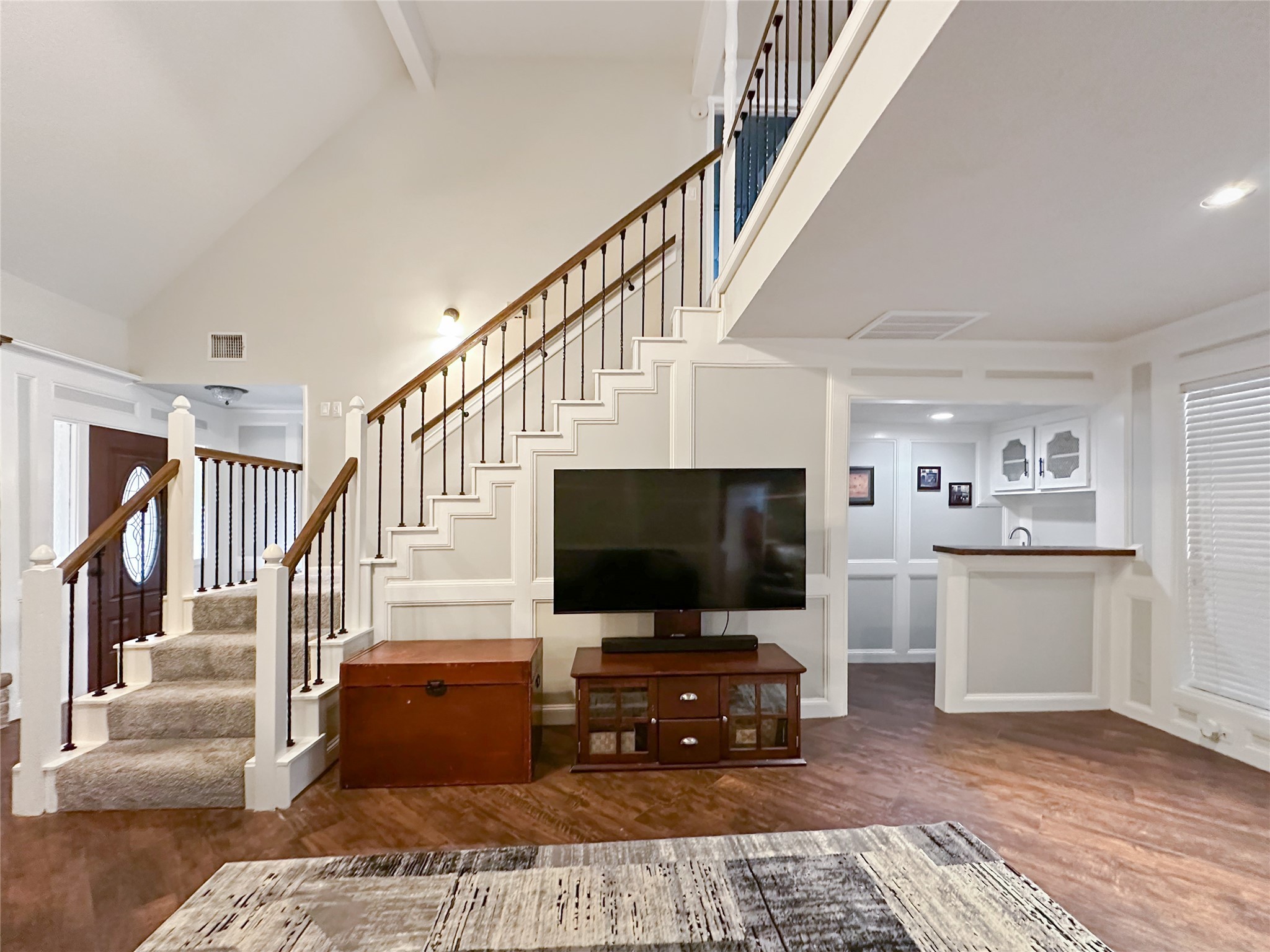 17407 Majestic Forest Drive Spring, TX 77379 - Photo 4 of 49 a living room with wooden floor and a flat screen tv
