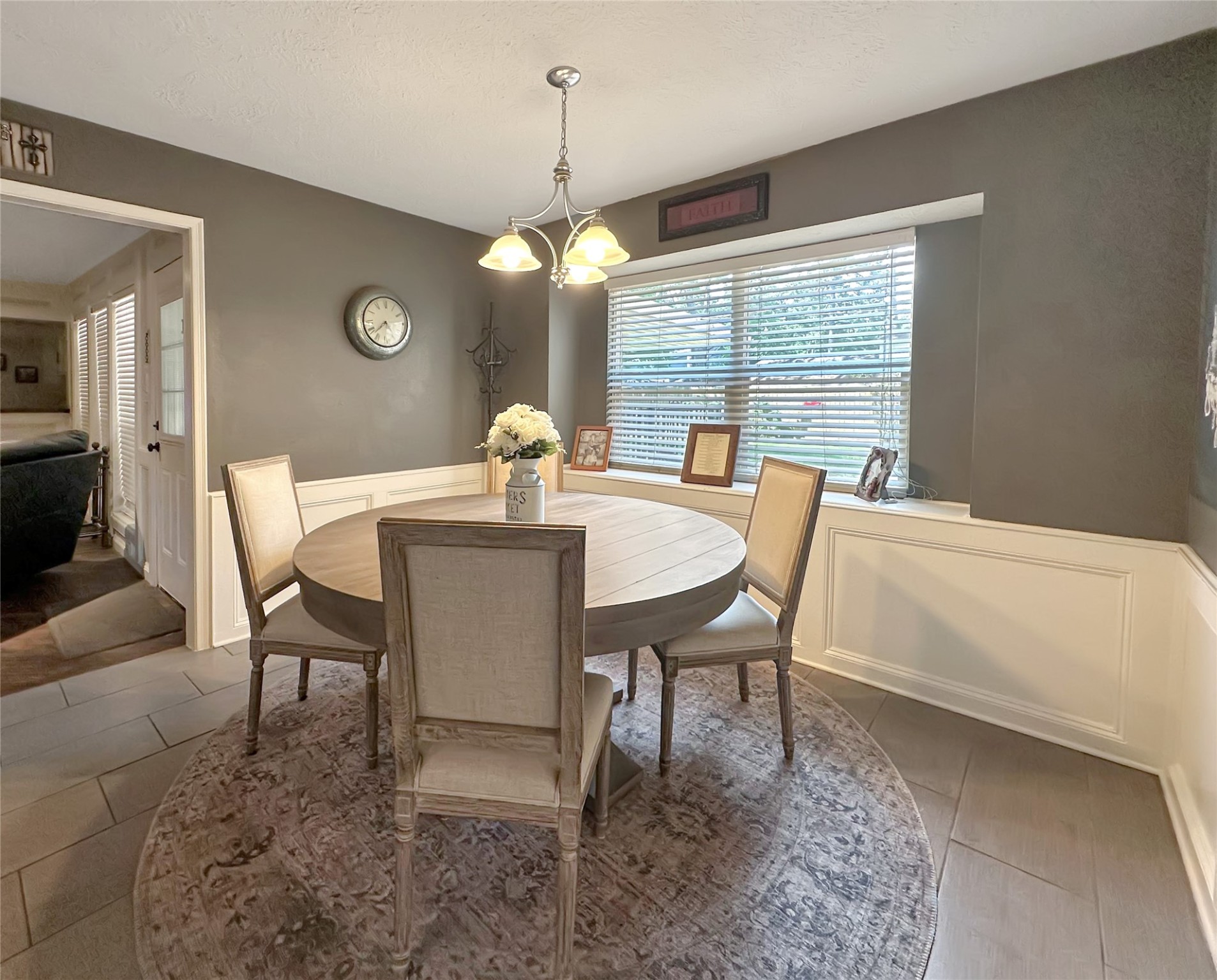 17407 Majestic Forest Drive Spring, TX 77379 - Photo 5 of 49 a dining room with furniture a chandelier and window