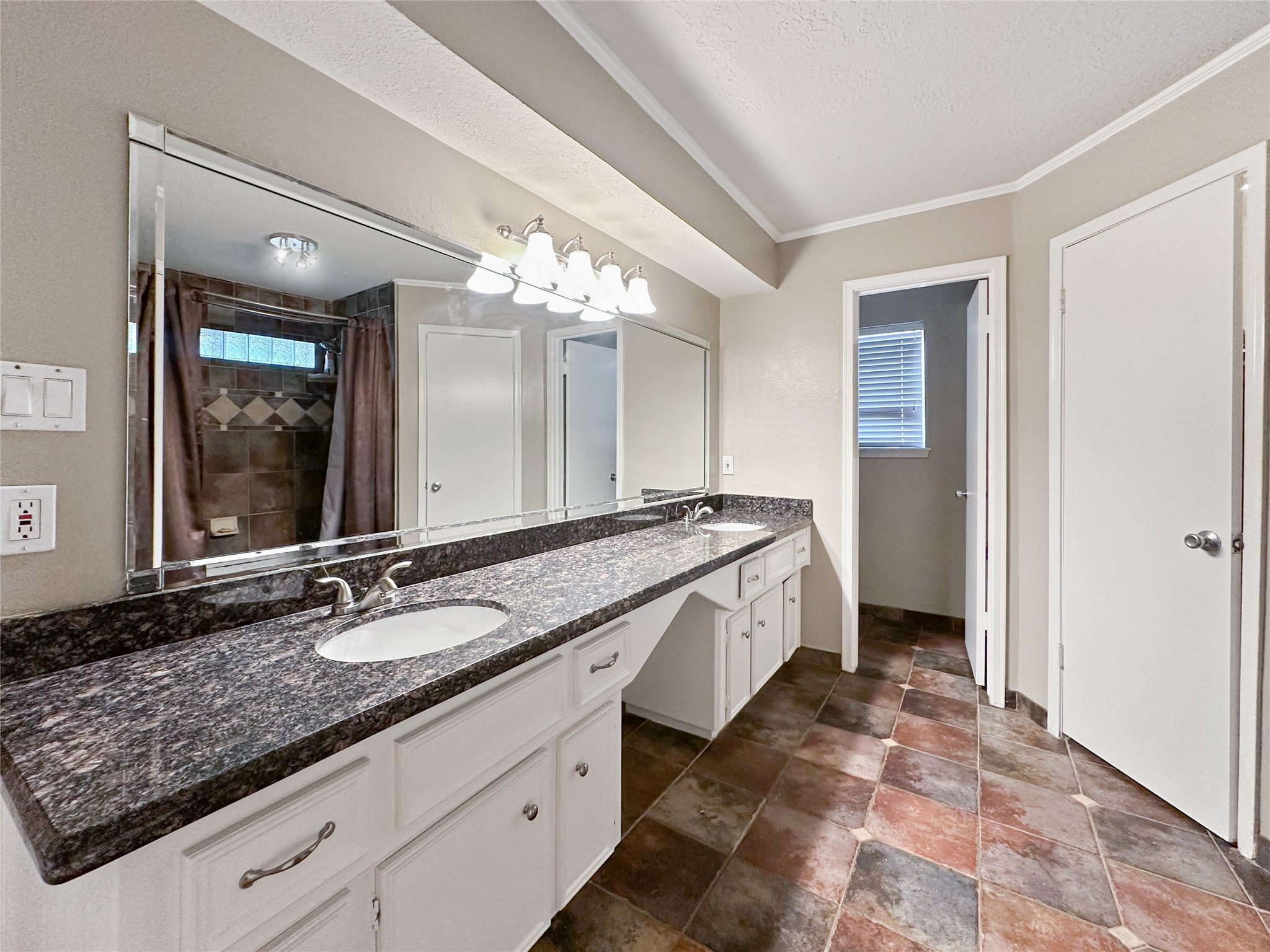 17407 Majestic Forest Drive Spring, TX 77379 - Photo 10 of 49 a spacious bathroom with a granite countertop double vanity sink a mirror and a shower