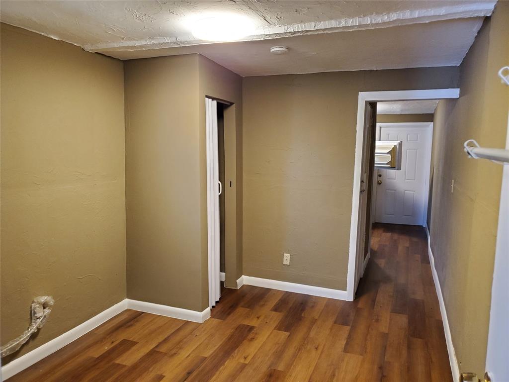 258 Adams Place, Unit 2 Pahokee, FL 33476 - Photo 20 of 25 a view of hallway with wooden floor