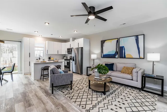 a living room with furniture and a rug